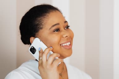 Woman happily talking on phone